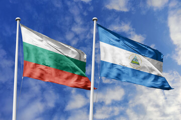 3D illustration. Bulgaria and Nicaragua Flag waving in the sky. High detailed waving flag. 3D render. Waving in the sky. Flags fluttered in the cloudy sky.