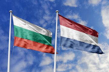 3D illustration. Bulgaria and Netherlands Flag waving in the sky. High detailed waving flag. 3D render. Waving in the sky. Flags fluttered in the cloudy sky.