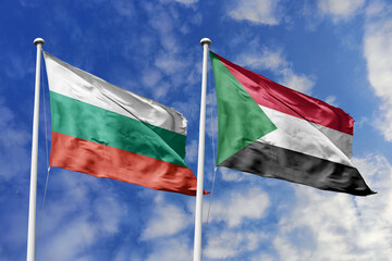 3D illustration. Bulgaria and Sudan Flag waving in the sky. High detailed waving flag. 3D render. Waving in the sky. Flags fluttered in the cloudy sky.
