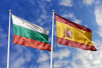 3D illustration. Bulgaria and Spain Flag waving in the sky. High detailed waving flag. 3D render. Waving in the sky. Flags fluttered in the cloudy sky.