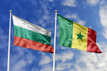 3D illustration. Bulgaria and Senegal Flag waving in the sky. High detailed waving flag. 3D render. Waving in the sky. Flags fluttered in the cloudy sky.