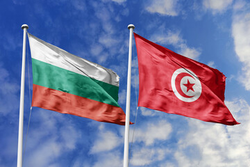 3D illustration. Bulgaria and Tunisia Flag waving in the sky. High detailed waving flag. 3D render. Waving in the sky. Flags fluttered in the cloudy sky.