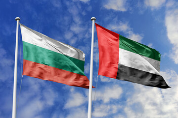 3D illustration. Bulgaria and United Arab Emirates Flag waving in the sky. High detailed waving flag. 3D render. Waving in the sky. Flags fluttered in the cloudy sky.