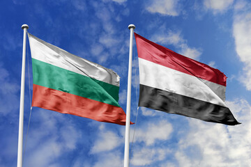 3D illustration. Bulgaria and Yemen Flag waving in the sky. High detailed waving flag. 3D render. Waving in the sky. Flags fluttered in the cloudy sky.