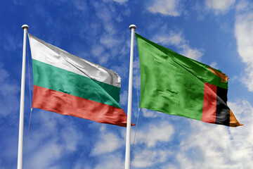3D illustration. Bulgaria and Zambia Flag waving in the sky. High detailed waving flag. 3D render. Waving in the sky. Flags fluttered in the cloudy sky.