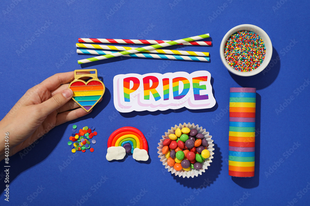 Wall mural lgbt parade concept, festive colorful symbols on blue background.