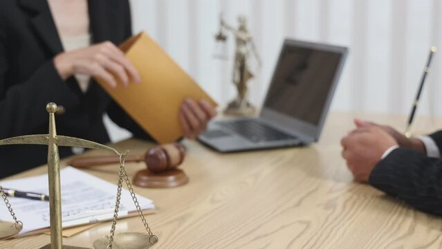 Judge Hammer and Lawyer Justice have a team meeting at the law office in the background. lawyer in office Concept of law and justice