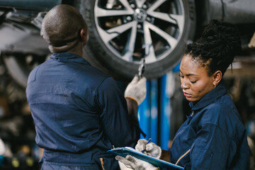 Mechanic Team Man and Women Staff Working Repair Vehicle in Car Service. Professional Worker Fix...