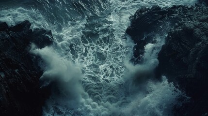 Obraz premium Waves crash against the rocks below carrying with them the anguished cries of lost souls and the haunting lullaby of a ghostly sea siren