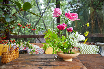 bouquet of garden flowers in a ceramic vase