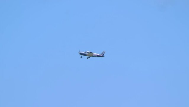 Small Airplane Gliding High in the Clear Blue Sky in 4k slow motion 60fps