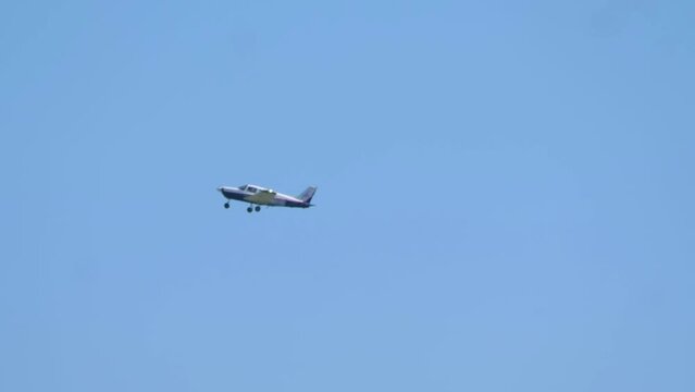 Small Airplane Gliding High in the Clear Blue Sky in 4k slow motion 60fps