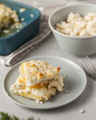 Homemade curd casserole pieces on plate in kitchen