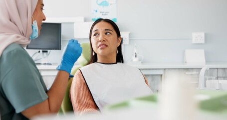 Woman, dentist and consulting with patient for dental care, teeth cleaning or treatment at the...
