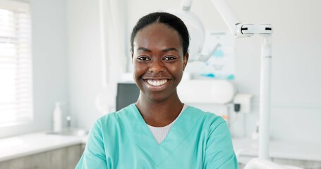 Face, smile and dentist with black woman in scrubs at hospital for dental care or oral hygiene....