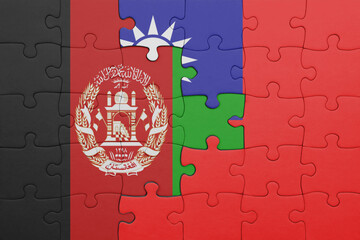 puzzle with the colourful national flag of taiwan and flag of afghanistan.