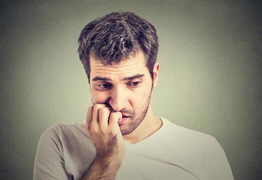 Preoccupied anxious young man overthinking