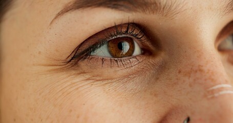 Eyes, thinking and future with person closeup in studio for hope, optimism or contemplation. Eye...