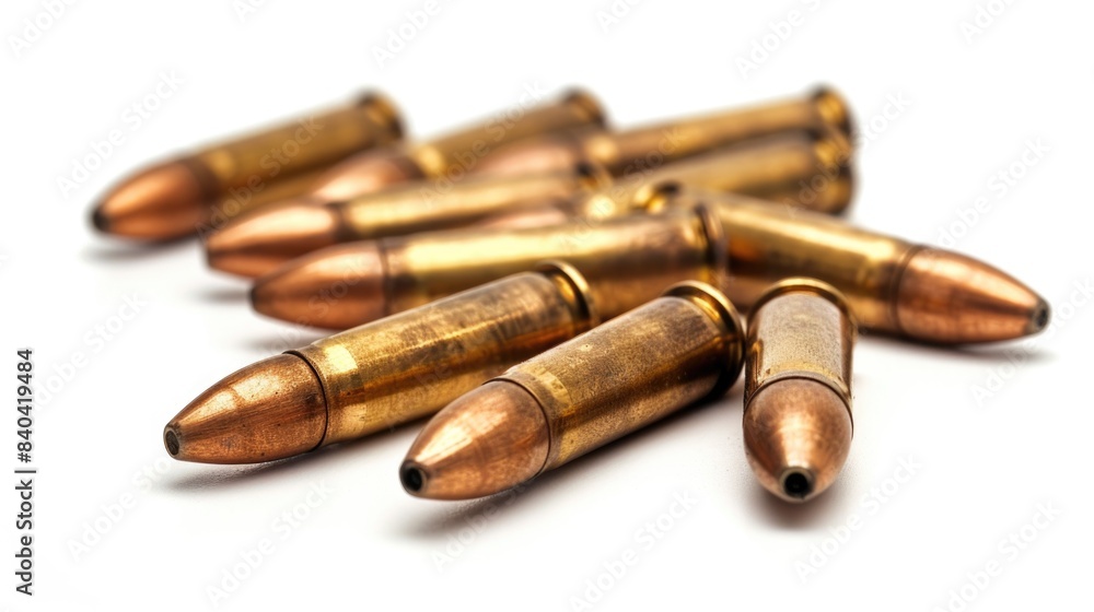 Poster a collection of bullet shells scattered on a white surface, suitable for use in editorial or educati