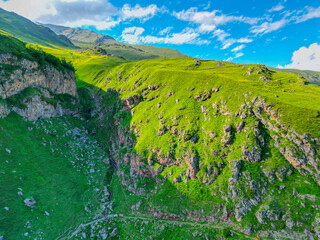  green grassy mountain landscape - aerial drone shot, background wallpaper