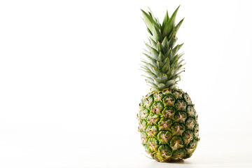 Fototapeta premium Ripe organic pineapple on white table background.