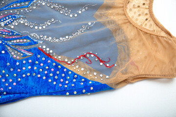 Blue velvet rhythmic gymnastics leotard on white background