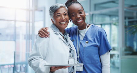 Portrait, doctor hug and nurse woman in hospital with smile for healthcare, collaboration or support. Embrace, medical team and professional health workers for happiness, teamwork or solidarity