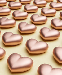 Repetitive flat lay of rows of chocolate rose coloured love hearts on a vibrant yellow background concept 3d render