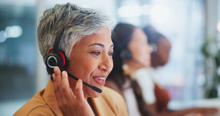 Mature woman, call centre and headset in office, telemarketing or customer service of client online...