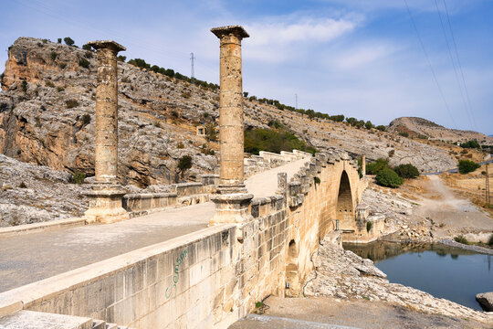 The 2nd century AD Severan Roman Bridge on the Cendere River with the columns of the Roman Emperor Septimus Severus and Empress Julia Domna, Turkey Minor