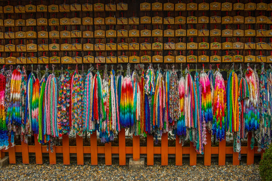 Colourful prayer ribbons at the Endless Red Gates of Kyoto's Fushimi Inari, Kyoto, Honshu