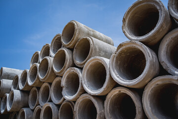 A stack of concrete ring pipes piled and creating a symmetrical arrangement