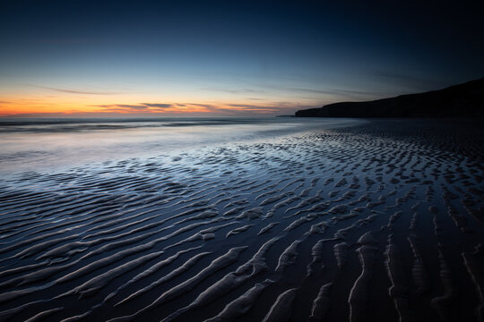 Sunset and Sand Ripples at Watergate Bay, Cornwall, England, United Kingdom