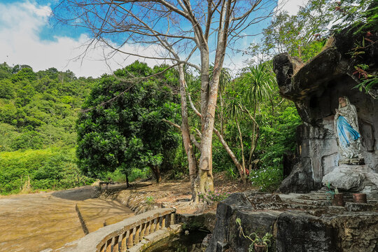 Statue of the Madonna in a grotto at this volcanic tourist park with a peace tower and worship houses of five major religions, Bukit Kasih, Minahasa, North Sulawesi, Indonesia