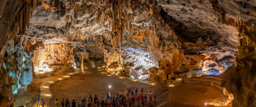 View of visitors viewing stalagmites and stalactites in the interior of Cango Caves, Oudtshoorn, Western Cape