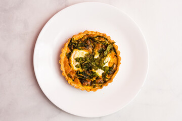 Spinach and ricotta quiche on a plate