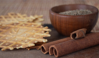 Italian aniseed biscuits with their flavoured ingredients. Side view photo.