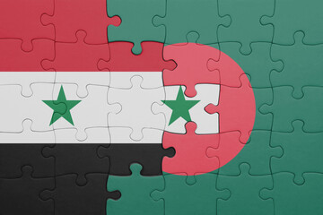 puzzle with the colourful national flag of bangladesh and flag of syria .
