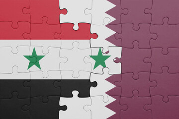 puzzle with the colourful national flag of qatar and flag of syria .