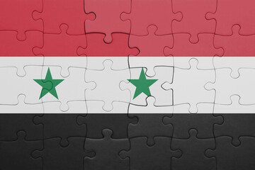 puzzle with the colourful national flag of yemen and flag of syria .