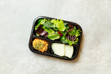 Vegetable salad and side dishes in a lunch box
