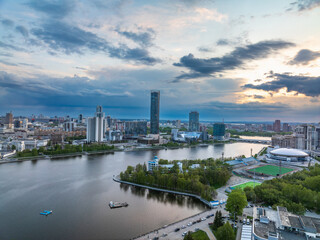 Naklejka premium Yekaterinburg city with Buildings of Regional Government and Parliament, Dramatic Theatre, Iset Tower, Yeltsin Center, panoramic view at summer sunset.