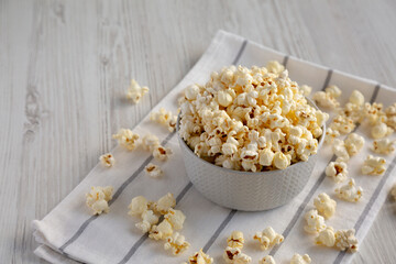 White Buttered Popcorn with Salt in a Bowl, side view. Space for text.