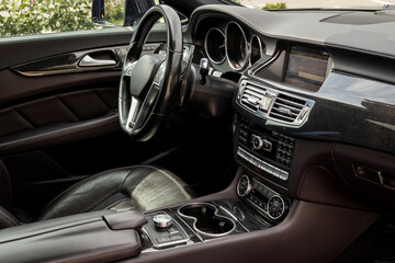 Modern car interior with steering wheel