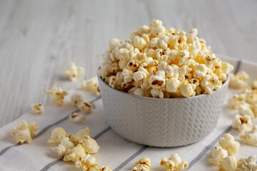 White Buttered Popcorn with Salt in a Bowl, side view.