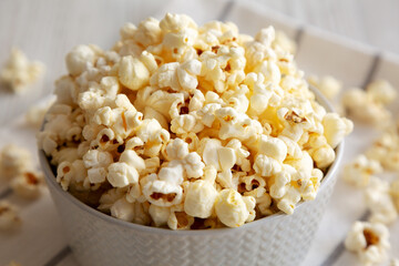 White Buttered Popcorn with Salt in a Bowl, side view. Close-up.