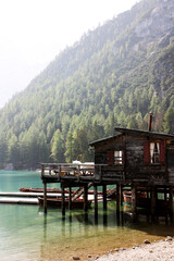 Fototapeta premium Old wooden pier on the Lake Braies, Dolomites, Italian Alps