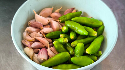 Chili and garlic in a bowl on the tableware