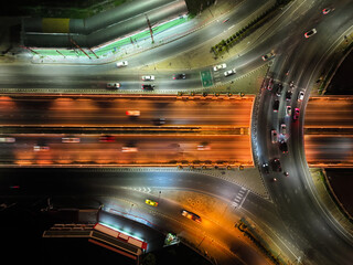 Expressway top view, Road traffic an important infrastructure, Drone aerial view fly in circle, traffic transportation, Public transport or commuter city life concept of economic and energ, transport.
