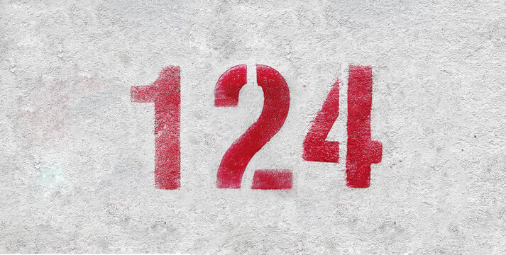 Red Number 124 on the white wall. Spray paint.